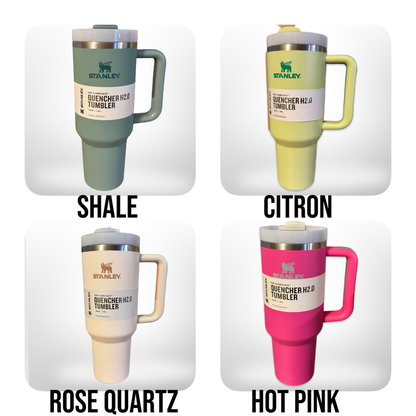 four different colored coffee mugs with names on them